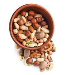 Bowl with different nuts on white background
