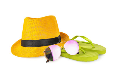 Beach hat with sunglasses and flip-flops on white background