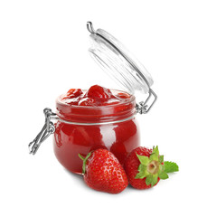 Glass jar with tasty strawberry jam on white background