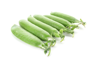 Pods with fresh green peas on white background