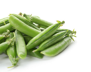 Pods with fresh green peas on white background