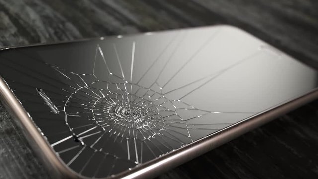 Hammer smashes smartphone in slow motion.  Angry destroying mobile technology.