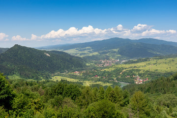 Naklejka na ściany i meble View of the little mountain town. Palenica mountain, popular ski lift in Pieniny National Park, Carpathian mountains