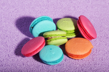 Bright macaroons on bright background