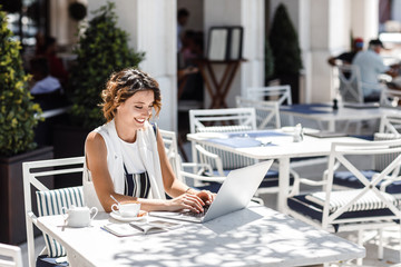 Woman Freelancer Working at Cafe