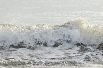 夕日の波打ち際