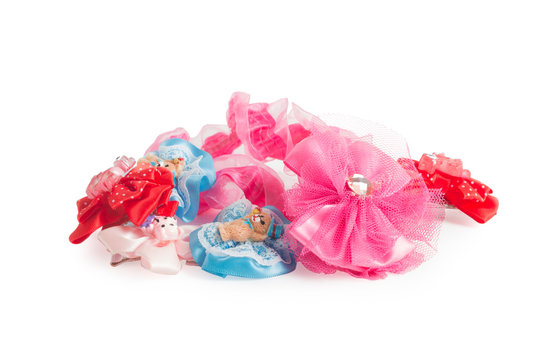 Bows, elastic bands, hairpins - hair decorations for a little girl isolated on white