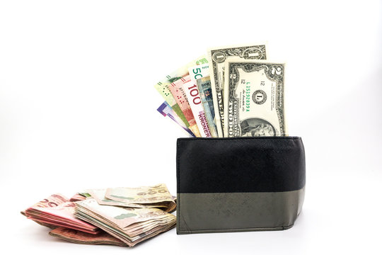 Multi Currency Banknotes In The Men's Wallet