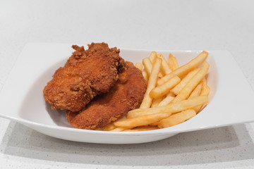 Deep-fried meat with French fries