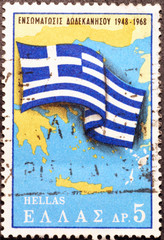 Greek flag over map of Greece on postage stamp