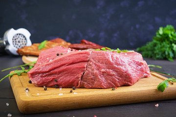 Raw meat. Fresh beef on wooden background