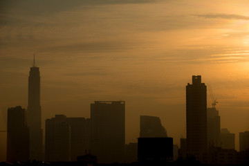 Fototapeta na wymiar BANGKOK, THAILAND - JANUARY 16, 2018 : Silhouette of Bangkok city view with beautiful sunrise background