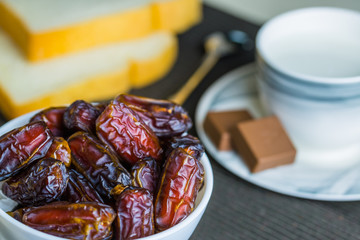 Dry dates fruit in small bowl