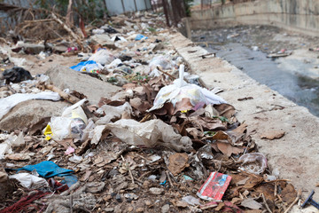 Rubbish dump by the road at living area