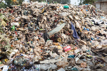 Big rubbish dump by the road at living area