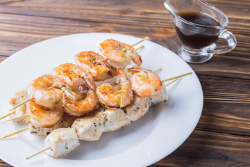 fried shrimp and chicken with teriyaki sauce