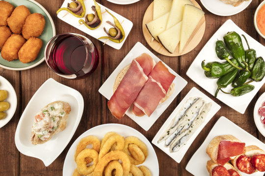 Spanish food. Overhead photo of various tapas with wine