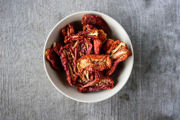 Dried tomatoes in ceramic bowl
