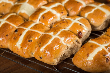 Homemade fresh from the oven hot cross buns on cooling rack