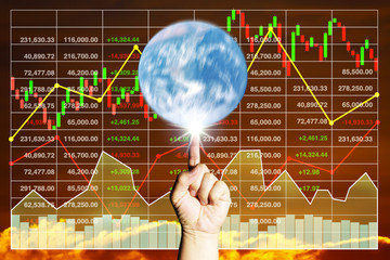 Finger spin the earth on analysis of stock data background chart.The manipulation of stock...