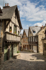 Fototapeta na wymiar Cobbled street among the beautiful half timbered houses in Dinan, Brittany