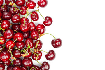 Sweet red cherries isolated on white background with copy space for your text. Top view. Flat lay pattern