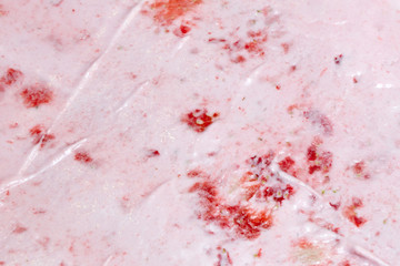 Roll ice cream is made by hand on the freezer. Sweet dessert made from natural berries and ingredients. The process of making food.