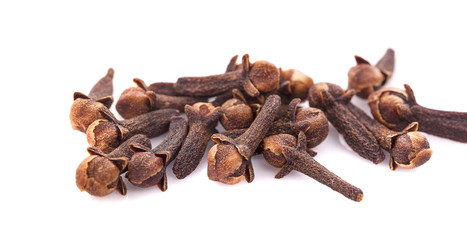 dry cloves on white background