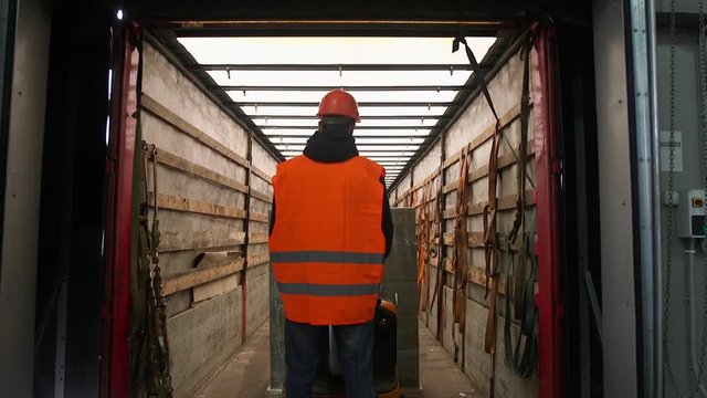 Forklift loader load boxes into a truck