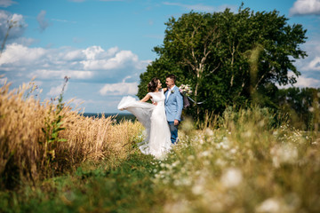Wedding day. The bride and groom on the nature
