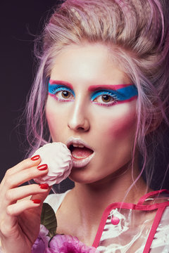 Gorgeous woman in biofuture pompadour style. Female in fashion transparent raincoat with splendid make up and hairstyle
