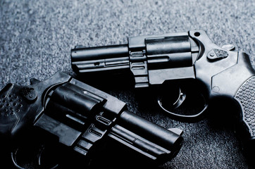 pistols on a dark background