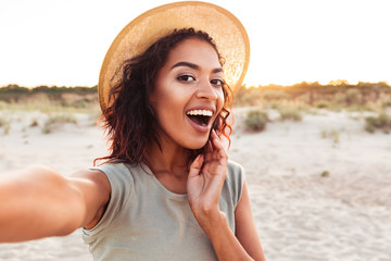 Close up of cheerful young african girl in summer