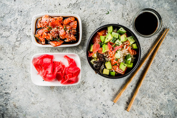 Asian trendy food, sushi poke bowl with cucumber, salmon, avocado, Black and White Sesame Seeds