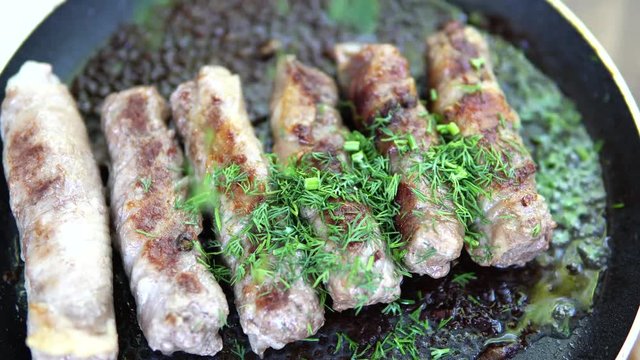 Preparation of meat dish from minced meat wrapped in bacon with white veins. Macro