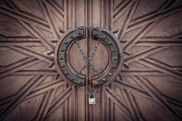 Carved door with lock on chain