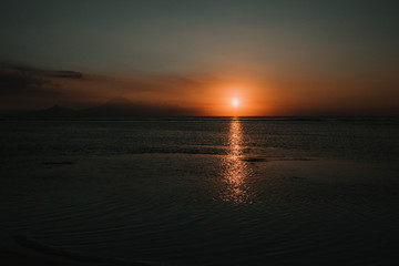 .Beautiful picture of the Gili Islands enjoying a colorful sunset in Indonesia. Photograph and vacation.