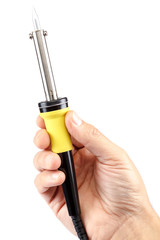 Soldering iron in a hand on a white background.