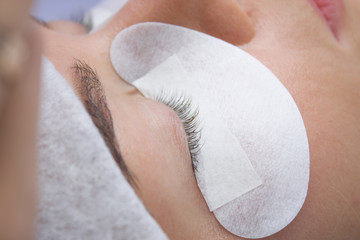 Preparation for Eyelash Extension Procedure. Woman Eye Close up macro shot - Beauty and fashion concept