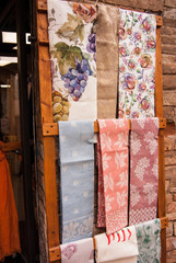 Many colorful headscarf hung as souvenirs