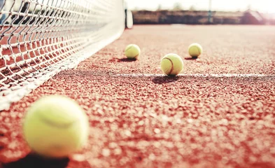 Fototapeten Tennis ball on the tennis court. Sport, recreation concept © bobex73