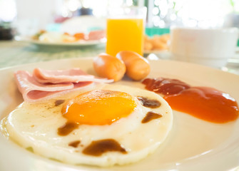 breakfast,egg,ham,sausage,coffee, milk and orange juice