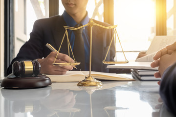 Business lawyer working about legal legislation in courtroom to help their customer