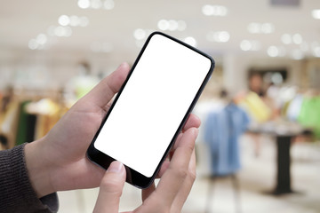 Man holding smart phone with blurred background. For Graphic display montage.