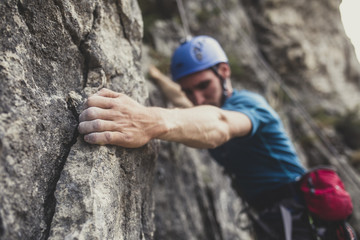 Mountaineer Climbing a Rock