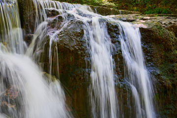 Fototapeta na wymiar Waterfall and stones. Long exposure. 
