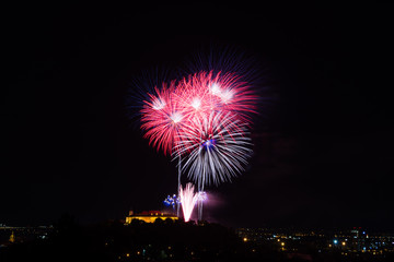 Beautiful colorful firework in city Brno on Spilberk
