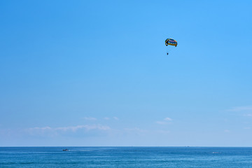 Parasailing on Tropical Beach in summer. 