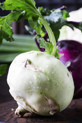 Green kohlrabi cabbage, brown background, selective focus