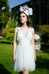 young sensual woman posing in elegant headwear